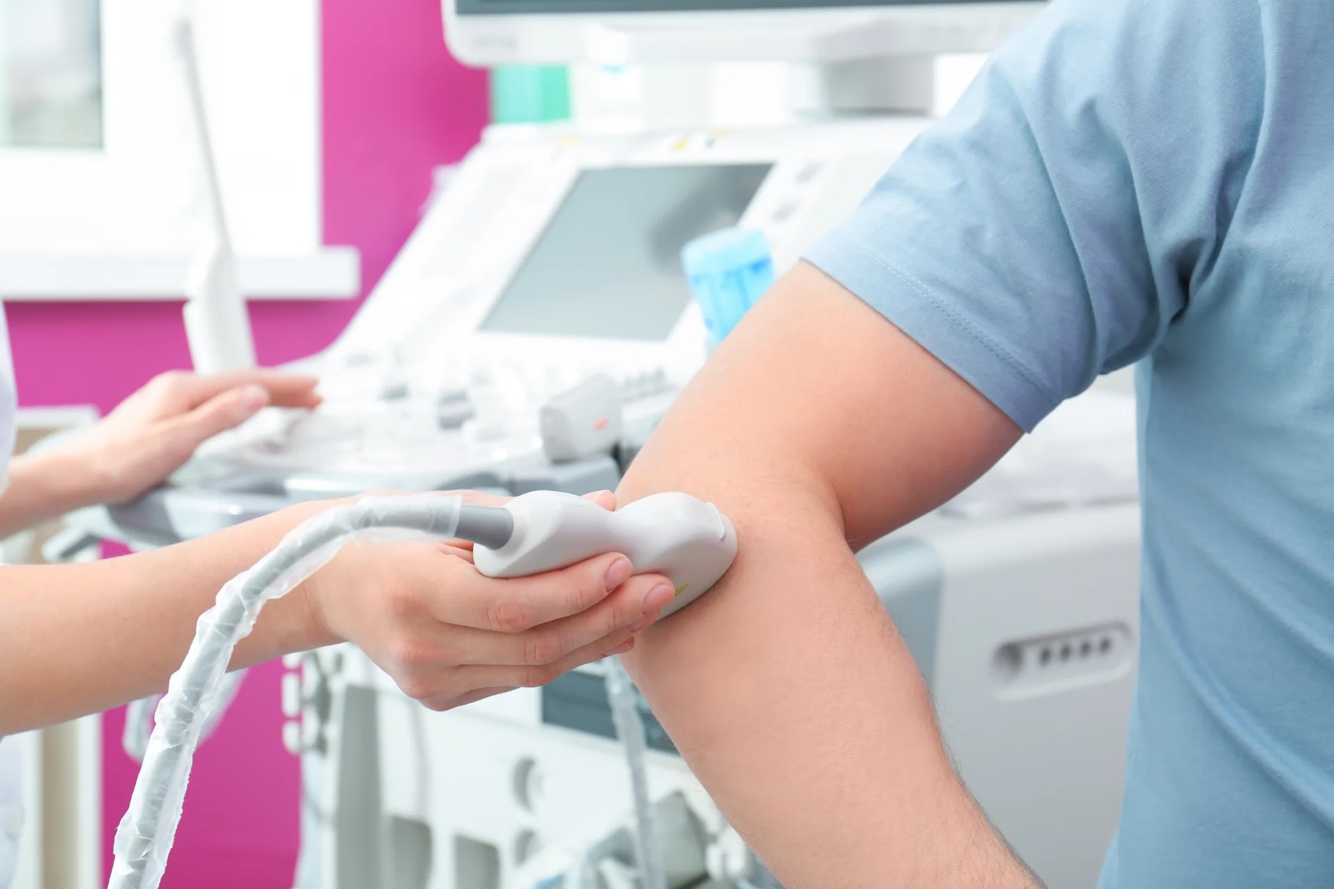doctor conducting ultrasound examination of elbow 2026 03 18 15 56 03 utc